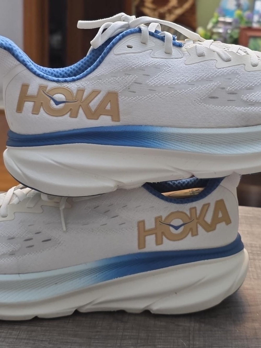 Hoka Women's White Running Shoes with Blue Gradient and Gold Logo